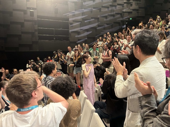 Director Naoko Yamada responding with a big smile to the continuous applause after the premiere screening at the "Annecy International Animation Film Festival 2024"