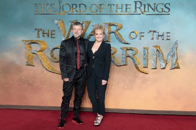 Andy Serkis and his wife, Lorraine Ashbourne, pose on the red carpet at the premiere.