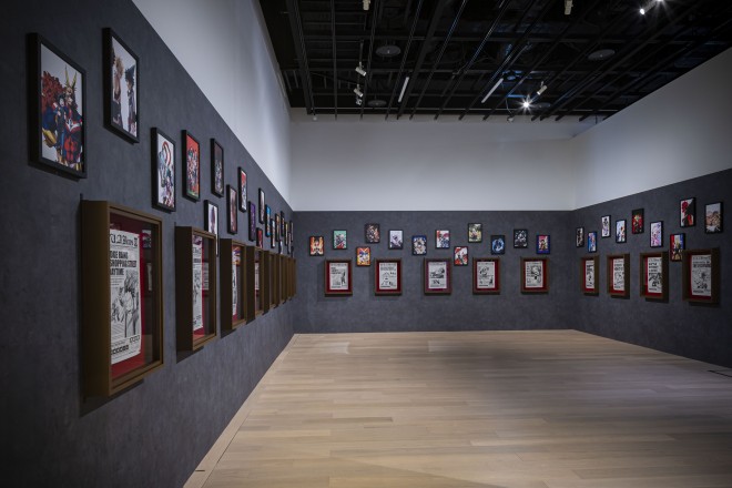 A powerful scene from the "My Hero Academia Original Art Exhibition" (Zone 4), capturing the final battle between heroes and villains. Featuring special illustrations by Kohei Horikoshi.