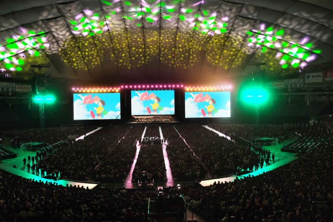 Joe Hisaishi conducts the Royal Philharmonic Orchestra at the Studio Ghibli Film Concert in Tokyo Dome.