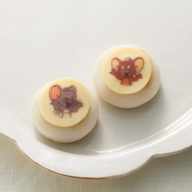 2026 two-tier Tom and Jerry Osechi set featuring traditional New Year dishes and cheese-inspired items.