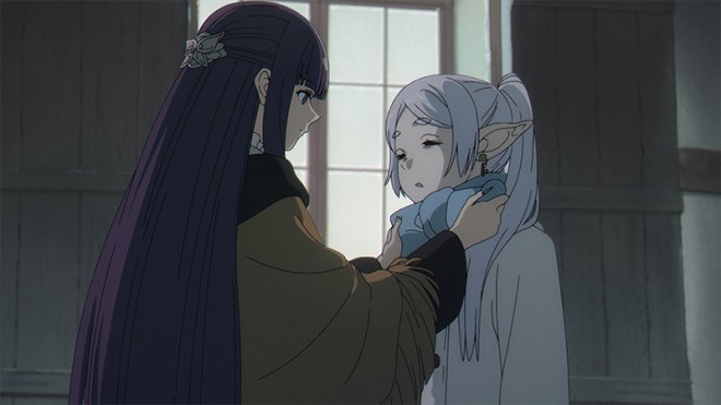 Fern puts a scarf around Frieren.
